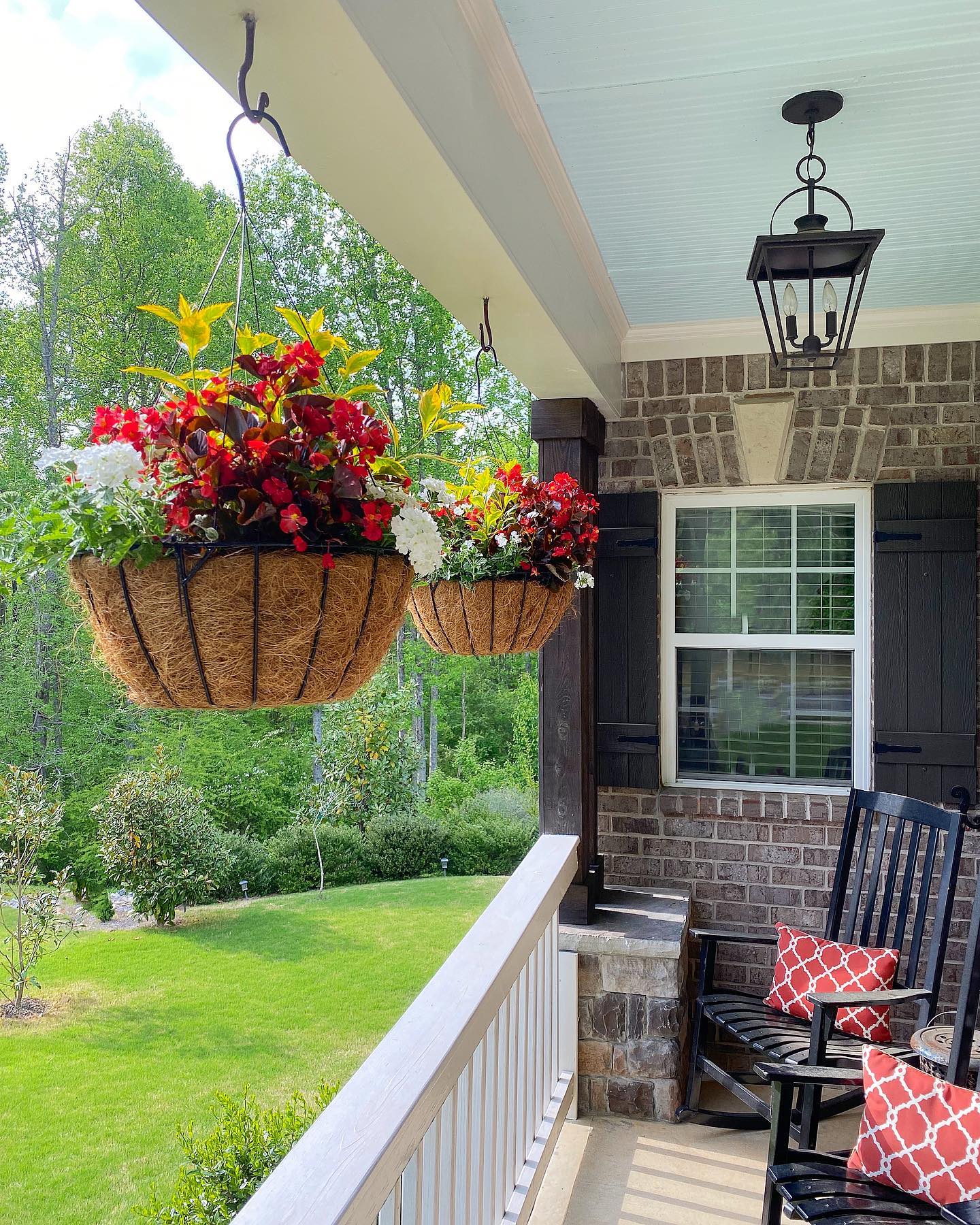 What a beautiful day, it was the perfect morning for a little front porch sitting and coffee ☕️ while admiring my pretty hanging baskets. I buy them every year from a little local garden shop, at Spot Rd. my local friends know the place you can shoot a gun, throw an axe 🪓 and buy the prettiest hanging baskets of the season 😂😂😂
. 
.
.
#jenrondesigns 
#flowergarden 
#frontporch 
#farmhouse 
#farmstyling 
#modernfarmhouse 
#diyhomedecor 
#diygarden 
#farmhousedesignrules 
#farmhouseinspired 
#modernfarmhouse 
#countryliving 
#countrylivingmagazine 
#countrylivingmag 
#countrysamplerfarmhousestyle 
#southernliving 
#southerncharm 
#homemakingissweet 
#flowerlovinfriends 
#seasonaldecorsaturdays 
#homedecor 
#dailydecordose 
#floraldesign 
#gardening 
#insta_neighborly 
 #homeshapeslives 
#homestylinginspo 
#homedesign 
#designinspiration 
#seasonaldecor 
#farmfresh